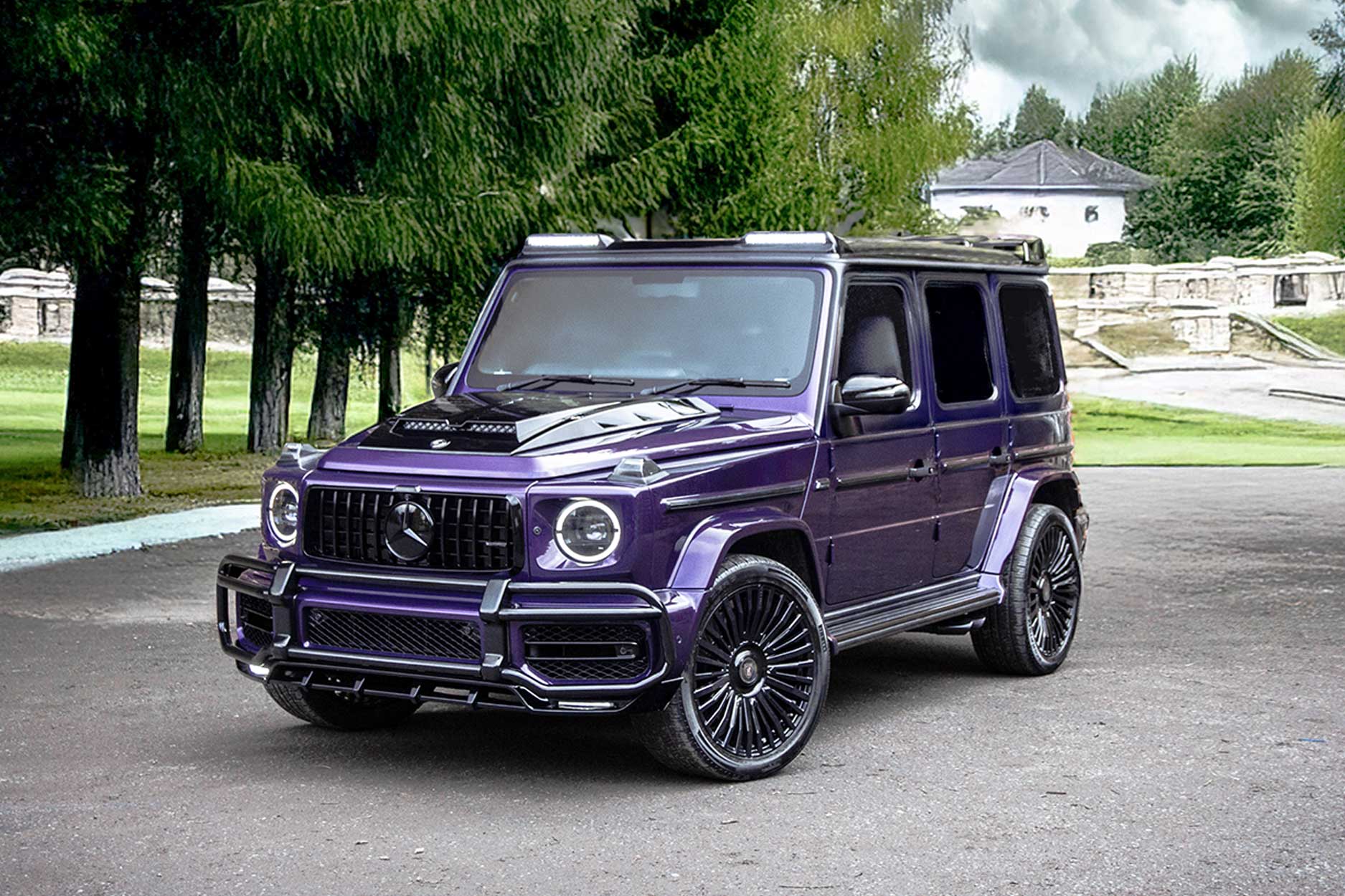 Front quarter view of a Purple Mercedes G Wagon 2018+. Shot outside a park backdrop. Fitted with Barugzai Casanova 22/23” alloy wheels, in Gloss Black.